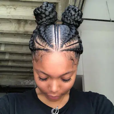 Goddess braids tied into a two high buns