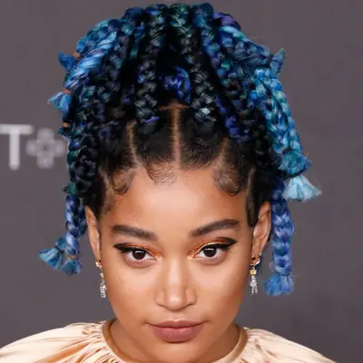 Amandla Stenberg with black and blue ombré goddess braids in a high ponytail at the 2019 LACMA Art + Film Gala in Los Angeles, California