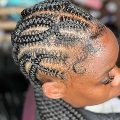 Goddess braids with criss cross design at the scalp
