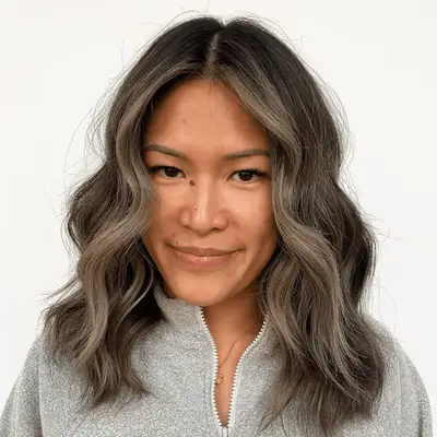 Brown-haired model with grey money piece layers.