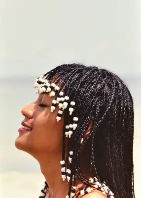 Woman in the 90s with beaded hair