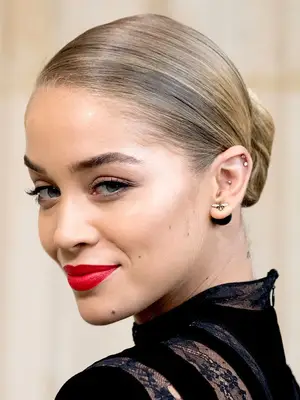 Jasmine Sanders with ashy blonde low bun 