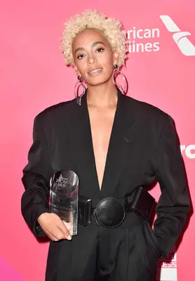 Solange with blonde curls 
