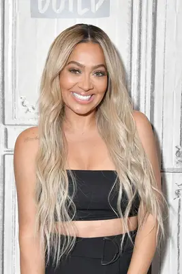 Lala Anthony with ashy light blonde waves 