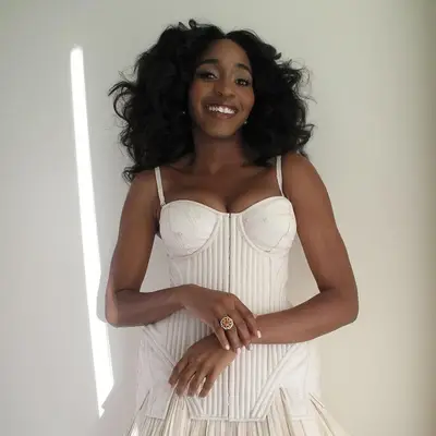 Ayo Edibiri with fluffy curls. 