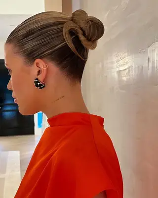 Sofia Richie wearing a bun.