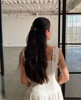 A hairstyle with a French barette.