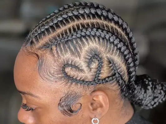 Close up of a heart braided into the side of a woman