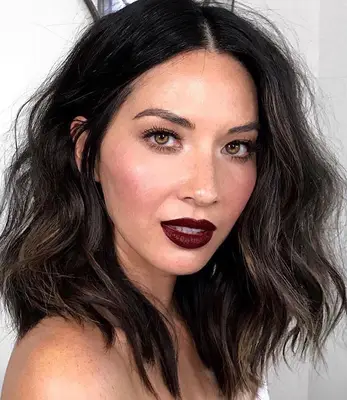 Close up of Olivia Munn with deep mocha hair color 