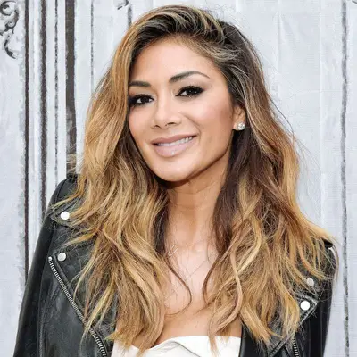 Nicole Scherzinger with mixed honey blonde hair and dark roots