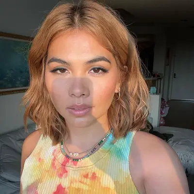 Hayley Kiyoko with dark honey blonde hair 