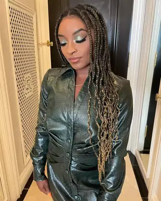 Simone Biles with blonde braids. 