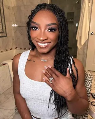 Simone Biles with a braided hairstyle. 