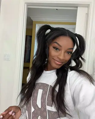 Simone Biles wearing a pigtail hairstyle. 