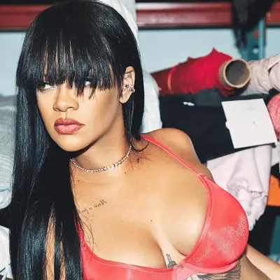 Rihanna in a red bra with choppy fringe 