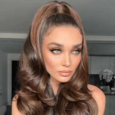 woman with a half up half down ponytail