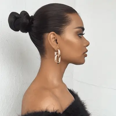 woman with sleek middle bun