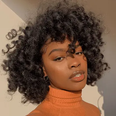 black woman with fluffy natural curls 