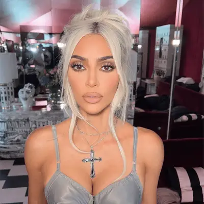 kim kardashian with white blonde hair in an updo
