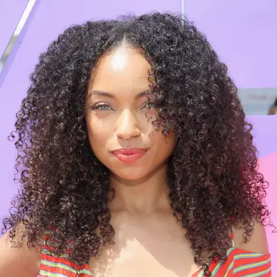 Logan Browning with a layered, curly fro