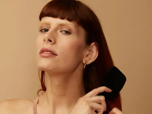 woman brushing hair