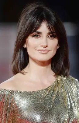 Close up of Penelope Cruz with curtain bangs and a center part