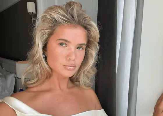 matilda djerf standing in window with blonde hair