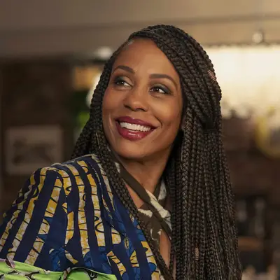 Karen Pittman smiling and looking to the side