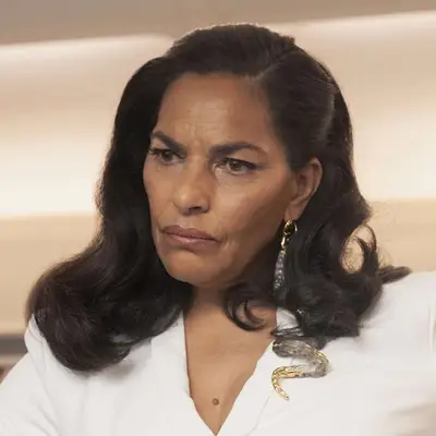 Sarita Choudhury appears with a focused expression, wearing elegant attire and jewelry