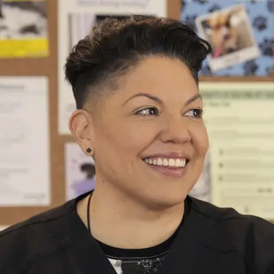 Sara Ramirez smiling indoors