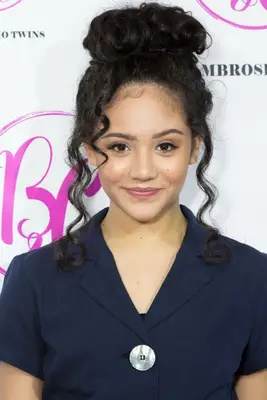 Sophie Santella with a curly bun and wavy face-framing hairs at Bianca And Chiara D