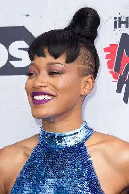 Keke Palmer with a high bun, mini bangs, and shaved sides at the 2016 iHeartRadio Music Awards in Inglewood, California