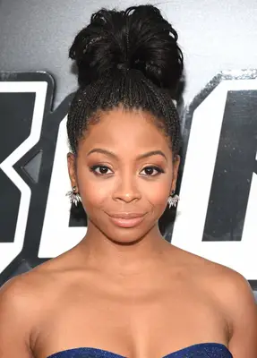 Bresha Webb with a braided topknot bun at the 2018 