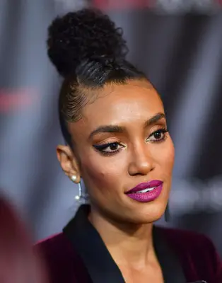 Annie Ilonzeh with a French-braided curly bun at the 2017 