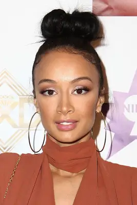 Draya Michele with a topknot bun at the 2015 Manifest Your Destiny Toy Drive And Fundraiser in Hollywood, California