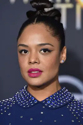 Tessa Thompson with an intricate avant-garde bun at the 2018 Disney