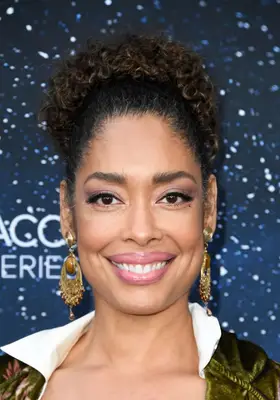 Gina Torres with a curly bun at the 2019 