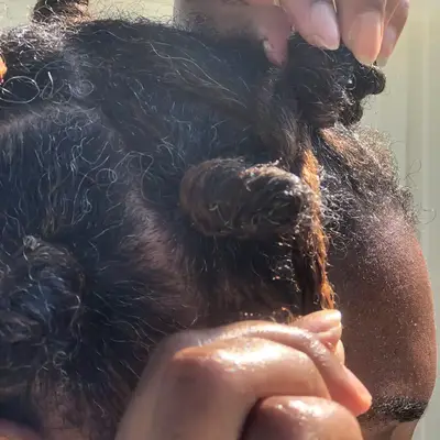 Bianca Lambert creating Bantu knots