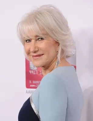 Helen Mirren with short platinum gray hair and wispy side-swept bangs on the red carpet