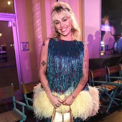 Miley Cyrus with a half-bouffant hairstyle at the Gucci Love Parade 2021