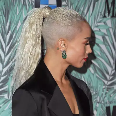 zoe kravitz wearing mohawk high ponytail with shaved sides