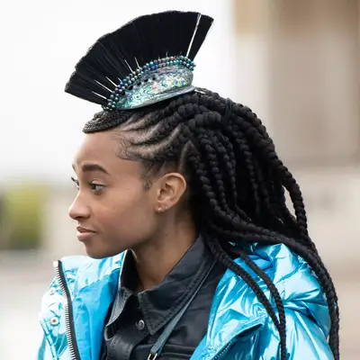 woman wearing mohawk braids with large cornrows 