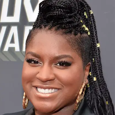 Ester dean wearing braided ponytail with shaved sides