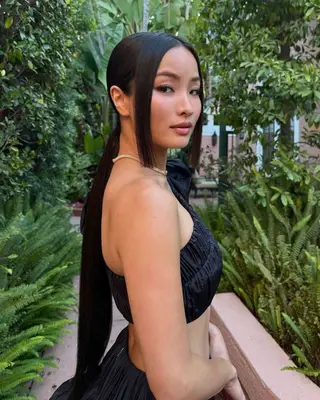 A long low ponytail with blunt cut tendrils