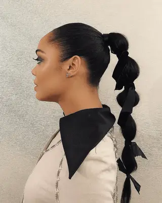 Sleek long ponytail with simple loose waves