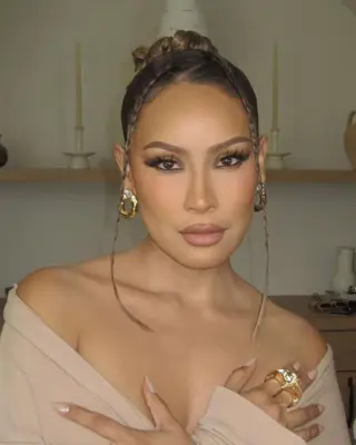 Slicked bun with braided tendrils