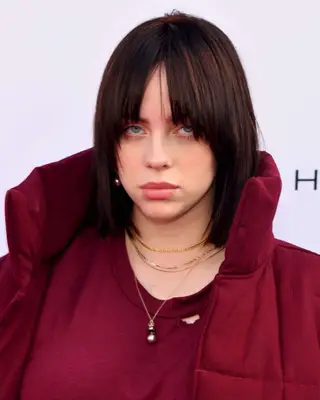 Billie Eilish with a straight, shaggy haircut