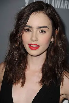 Lilly Collins with beachy waves