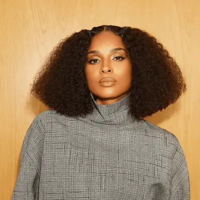 Ciara wearing a middle part curly bob