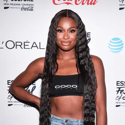 Coco Jones wearing crimped hair with middle part
